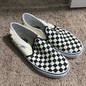 Women’s  black and white Slip-on checkered Vans